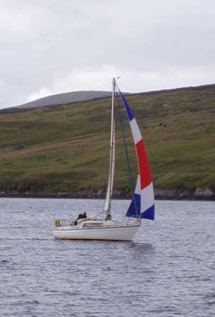 Khalida under sail.  She's an Offshore 8m, designed by Dutch boat wizard Van de Stadt.  She's 8m (26ft 3ins) long with a fin keel.