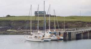 Khalida (nearest the camera) moored up on the island of Papa Stour (the big island of the priests) with other boats from Brae Marina.