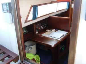 Khalida's chart table with log book and radio.